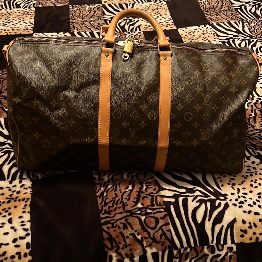 SOLD  price  Louis Vuitton keepall 55 comes w strap and lock